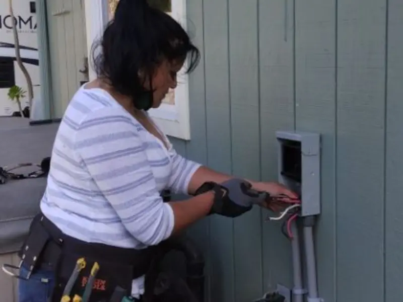 Licensed electrician wiring an exterior subpanel in Moses Lake